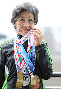 Noriko Sakota with her marathon medals. 