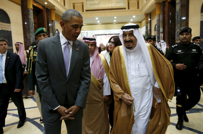 Obama walks with King Salman at Erga Palace upon arriving for a summit meeting in Riyadh, Saudi Arabia. — Reuters photo