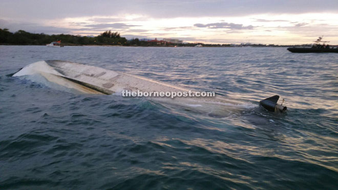 The 28-foot fiberglass boat that capsized near Sutera Harbour Resort.