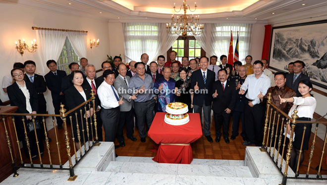 Front row, from second left, Frankie, Yeo, Yong, Liew, Pairin, Chen, Teo, Tee, Abdul Rashid, Pang and others celebrate the first anniversary of the Chinese consulate general.  