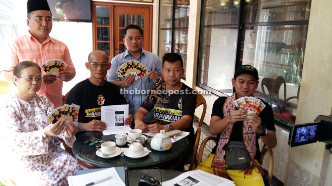 Peter (seated second left) and his team in a photo call at the press conference. 