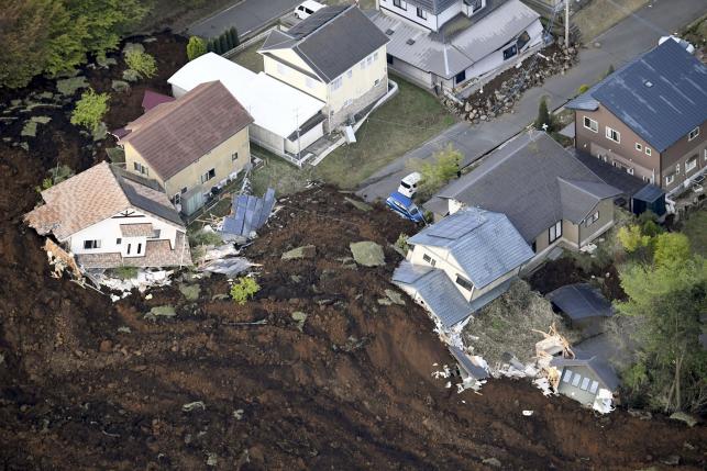 The aftermath of a landslide and destroyed houses caused by an earthquake are seen in Minamiaso town, Kumamoto prefecture, southern Japan, in this photo taken by Kyodo April 16, 2016. Mandatory credit REUTERS/Kyodo