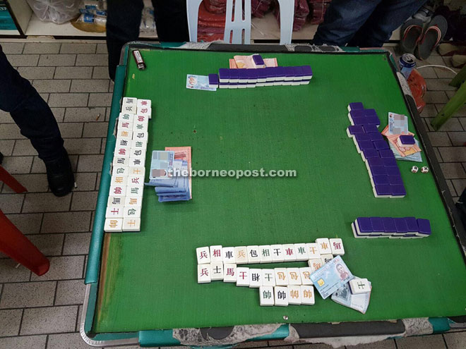 Gamblers playing mah-jong at this table were caught red handed during one of the recent raids.