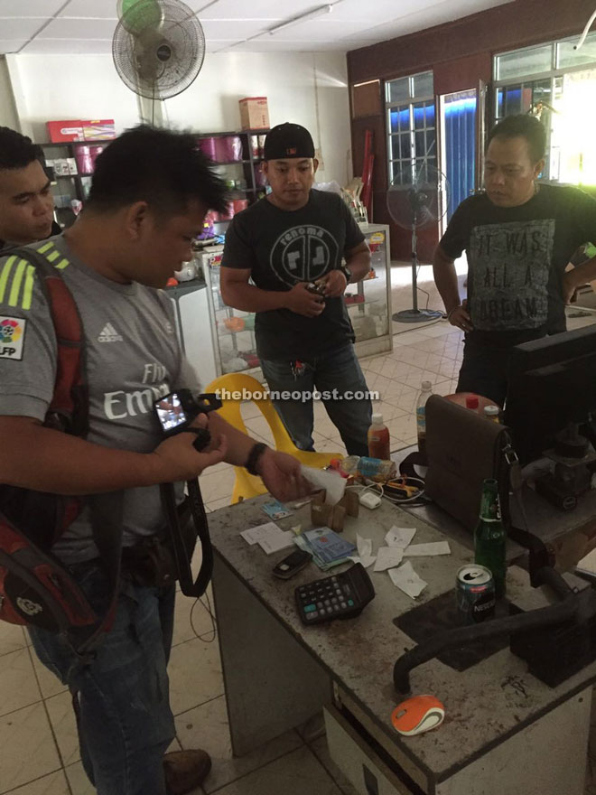 A CID team checking a suspected gambling den during the state-wide blitz.