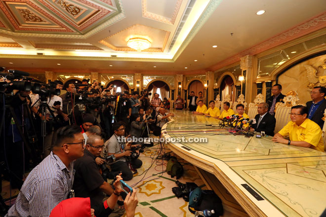 Adenan (second right) speaking during the jam-packed press conference at his office in Wisma Bapa Malaysia yesterday.
