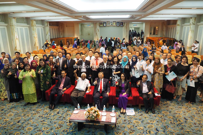 Morshidi (seated centre) in a group photo with representatives of GETS partner companies and interns of GETS. 