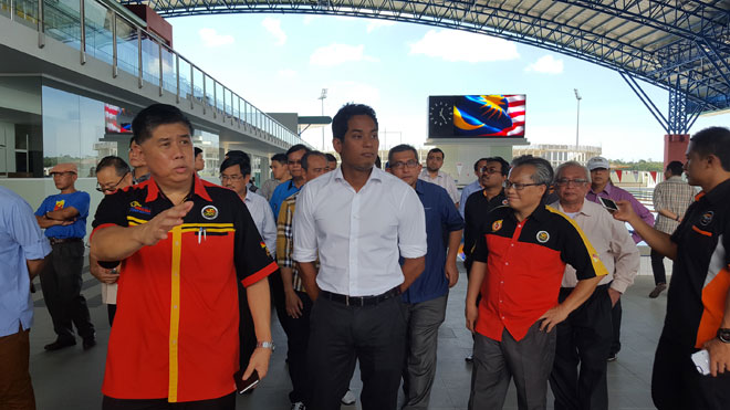 Dr Ong and Khairy at the new Aquatics Centre in Petra Jaya yesterday.  •  See also Page 26