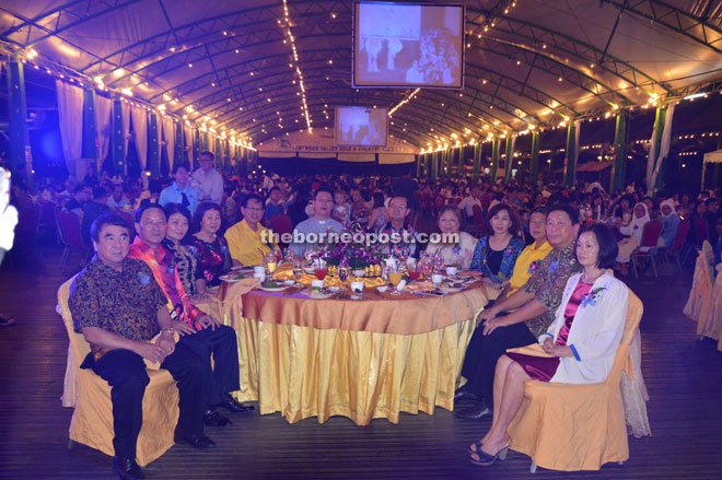 Bishop Richard (sixth left), flanked by Chin (on his right) and Lee, and other supporters enjoy the performances at the dinner. 