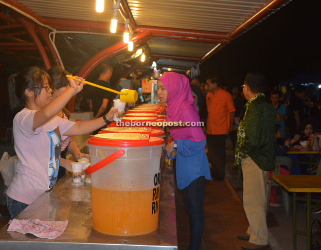 Visitors quenching their thirst at Bandong Walk.