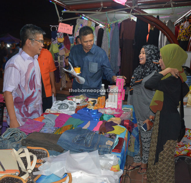 Dr Annuar (left) checks out one of 23 stalls at Bandong Walk in a file photo.