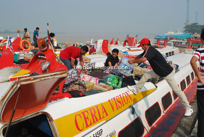 File photo showing goods being placed on the roof top of an express boat.