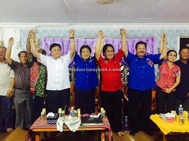(From left) Mawan, Kilat, Banyie and others raise their hands in a gesture of their solidarity in facing the 11th state election.