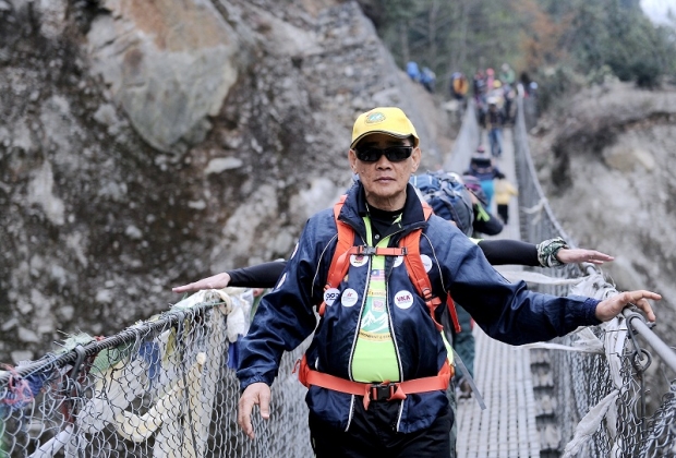 Malaysia’s oldest mountain climber James Lee Chong Meng crosses a bridge as he takes part in the Lions Mount Everest Expedition (MEE) 2016 in Lukla, Nepal April 5, 2016. - Bernama photo