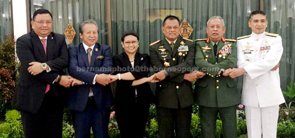 Anifah (second from left) with some of the Indonesian and Philippine delegates at the special meeting. — Bernama photo
