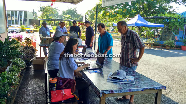 Voters at SK getting their ID check on the electoral roll before proceeding to cast their ballots.  