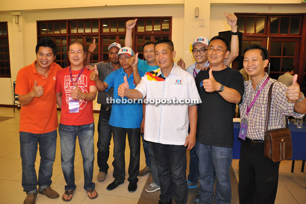 See (fourth right) and his supporters gesture as they celebrate their victory in this state election. 