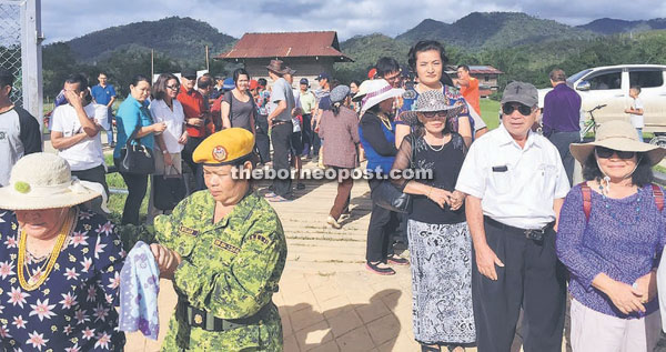 Voters gather outside SK Bario while waiting for their turn to cast their vote.