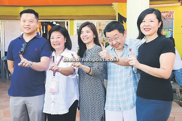 Janet (second left) and her family outside the polling station after voting.