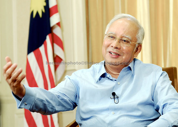 TENANG: Najib memperkatakan sesuatu semasa ditemu bual sempena Ulang Tahun UMNO ke 70 di Bangunan Perdana Putra, Putrajaya. — Gambar Bernama