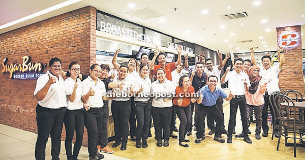 Photo shows staff posing in front of the new SugarBun Borneo Asian Food outlet in Menara Hap Seng, located at the heart of Kuala Lumpur’s Central Business District.