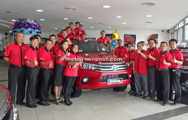 UMW Toyota Motor and Rimbunan Hijau Auto Services staff are seen with the all-new Hilux.