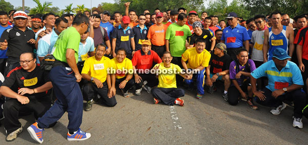 Participants of Sabah Royal Malaysia Police Healty Lifestyle programme pose for a photo.  