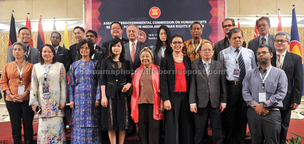 Chairman of Asean Intergovernmental Commission On Human Rights  Phuokhong Sisoulath (front, fourth right) having a group photo with all speakers of AICHR Regional Forum On Media and Human Rights In Asean. Rodziah is third from left.— Bernama photo