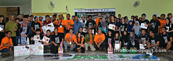 Braken (squatting ninth right) with officials, participants and winners of the 5th International Bornean Frog Race at Lambir Hills National Park.