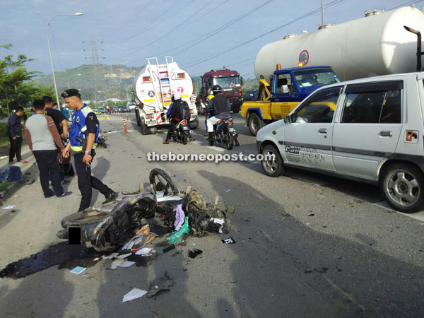 The victims’ motorcycle that was damaged in the collision with the Perodua Myvi along KKIP Road.