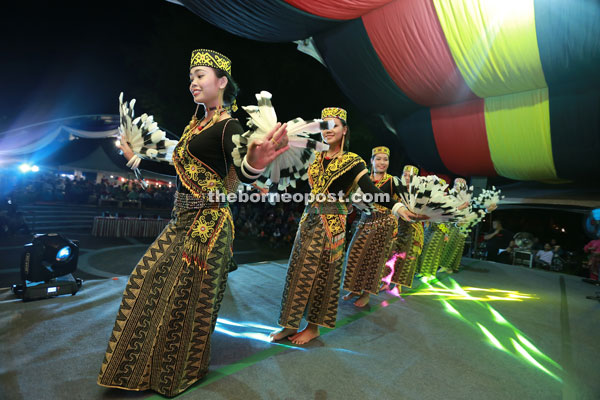 The welcoming dance at the official opening ceremony performed by Orang Ulu dance troupe Ladies of Hornbill. 