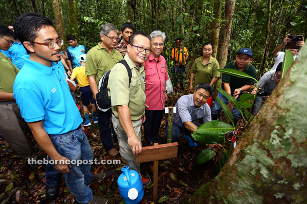 Sudarsono plants a tree sapling to mark the launch of the Fig Garden Project at Matang Wildlife Centre. — Photo by Muhammad Rais Sanusi