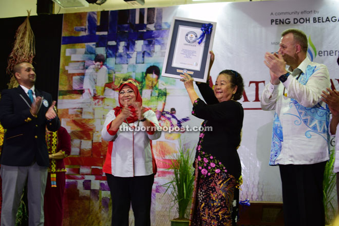 Debong (second from right) raising the Guinness World Record certificate as (from left) Nath, Rohani and Sjotveit applaud. 