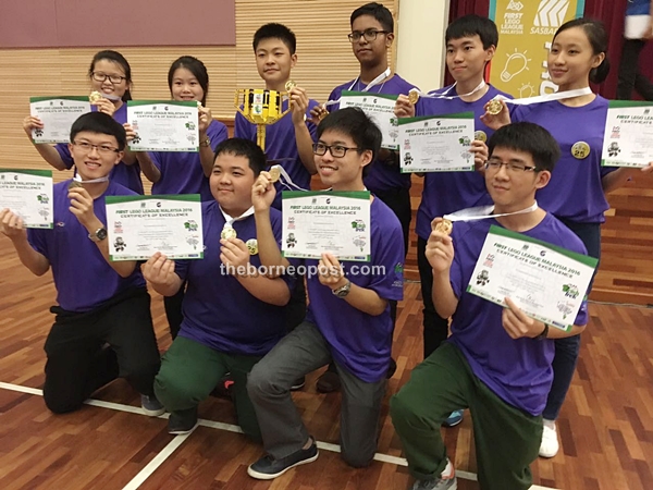 The winning students proudly display their awards.