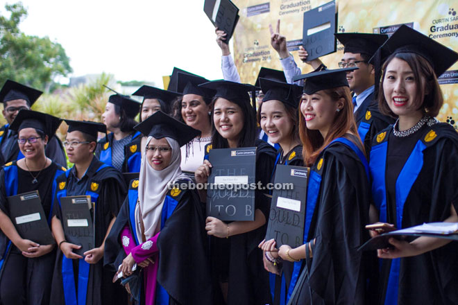 Graduates celebrating their achievement. 