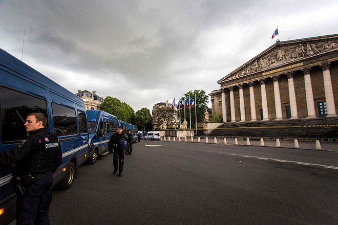 French gendarmes stand guard outside the National Assembly in Paris. The decisions are not final as the two houses of the French parliament now have to reach an agreement, or the bill will end up at the National Assembly, which has the final word. — Reuters photo 