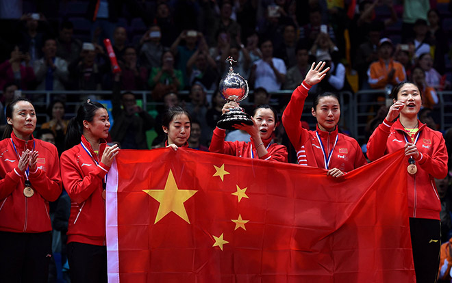 Li Xuerui of China holds the trophy of her team after the women’s finals group match in the Uber Cup badminton tournament in Kunshan, eastern China’s Jiangsu Province. — AFP photo