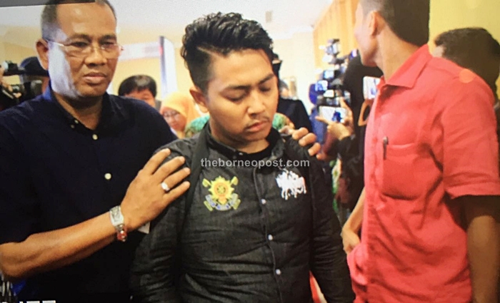 Noriah's son Shafiq arrives at Kuching International Airport.