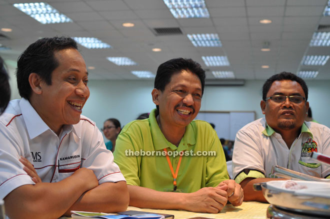 Kamarudin (left) and Berhaman (centre) speaking to the press.