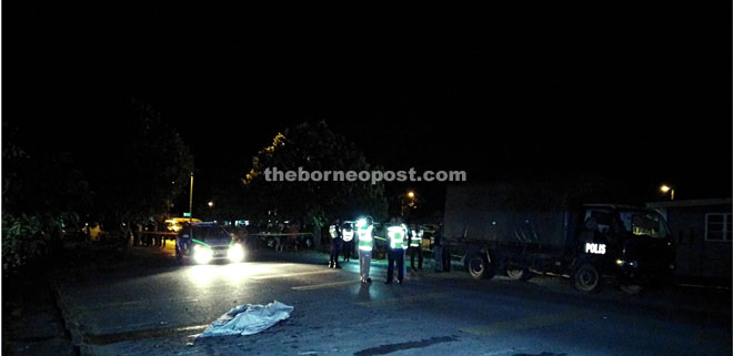 Police checking the scene. The victim’s body is at the foreground.