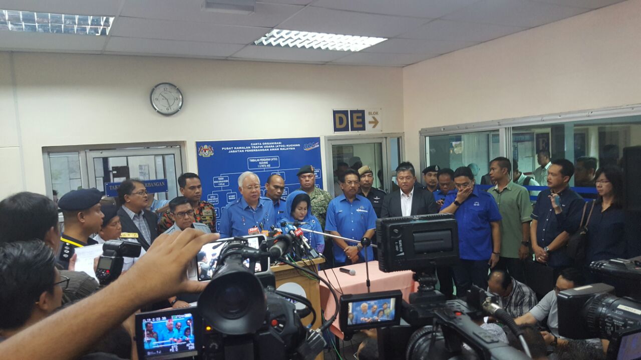 Prime Minister Datuk Seri Najib Tun Razak holding a pc at the DCA office this morning.