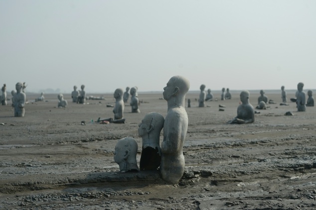 Statues stand semi-submerged in mud, a symbol of the human toll of the 2006 mud volcano disaster in Sidoarjo, East Java. Photo by AFP