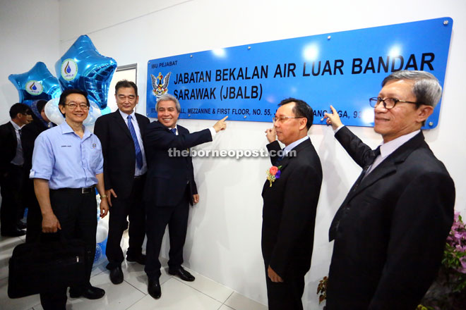 Awang Tengah (third left) and Dr Rundi (second right) pointing to the JBALB signboard at the new office at ST3. — Photo by Muhammad Rais Sanusi