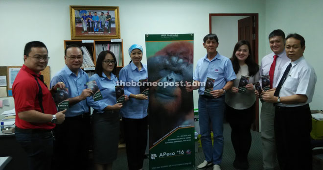 Dayang Azizah (fourth left), Kon (fifth left), Dylan (second right), Benedict (right) and others pose for a photocall with Apeco 16 banner and brochures.