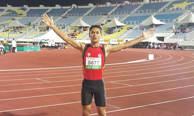 GOLD N0.12: Mohd Rizzuah al-Iqbal Muhd celebrates after winning the boy’s U-18 110m hurdles yesterday. He finished the race in 14.47sec while Mohd Naim Abdullah of Perak finished second (14.50) and Nur Izwan Abd Mutalib of Johor in third (14.62).