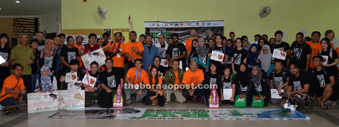 Braken (squatting ninth right) with participants and winners of the 5th International Bornean Frog Race at Lambir Hills National Park on Saturday night. 