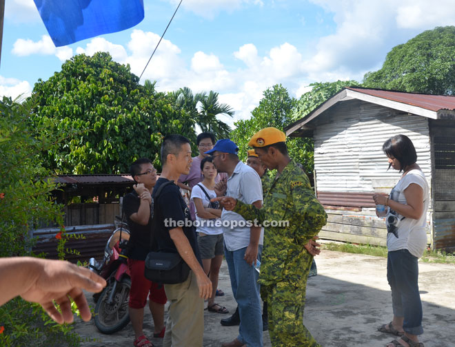 The man being advised to leave the venue by a Rela personnel.
