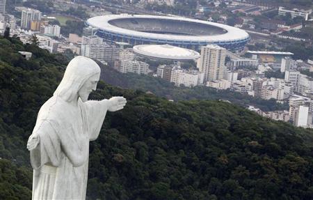 An aerial view of the famous Christ the Redeemer atop of Corcovado mountain in Rio de Janeiro, January 12, 2011. REUTERS/Bruno Domingos