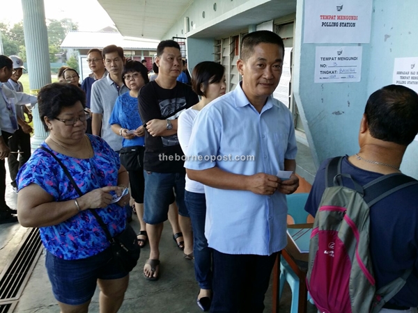Batu Lintang incumbent See Chee How queuing to vote at SK Garland in Batu Kawah. He is voting in Batu Kitang constituency.