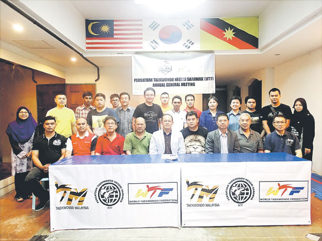 Delegates from affiliated clubs throughout Sarawak with Salleh (centre, seated) Raja (fourth left), Then (fourth right), Tan (third right) and committee members at Jalan Satok recently.