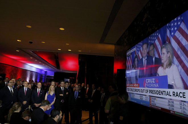 Campaign staff and supporters of Republican US presidential candidate Donald Trump watch as rival candidate for the Republican presidential nomination Senator Ted Cruz drops out of the 2016 race on a television inside Trump’s campaign event site in Trump Tower in Manhattan, New York, US. — Reuters photo